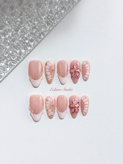 Belle Rose almond press-on nails with milky pink French tips, hand-painted petals and 3D floral accent – Éclaire Studio