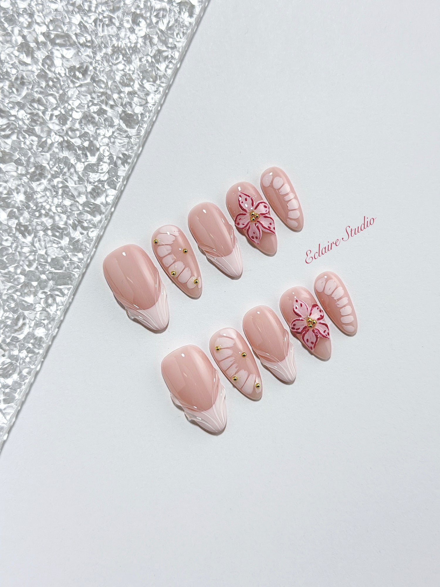 Belle Rose almond press-on nails with milky pink French tips, hand-painted petals and 3D floral accent – Éclaire Studio