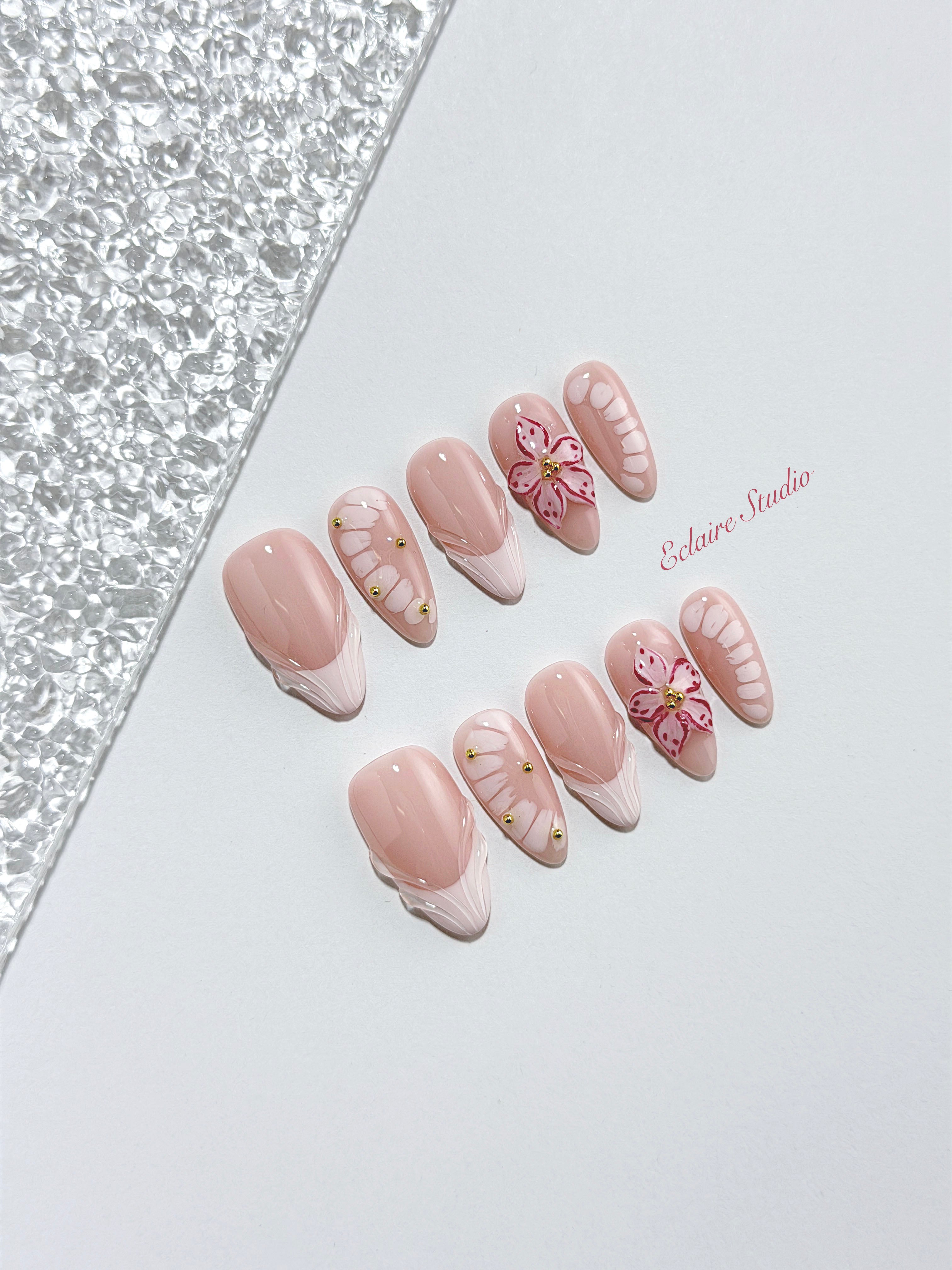 Belle Rose almond press-on nails with milky pink French tips, hand-painted petals and 3D floral accent – Éclaire Studio