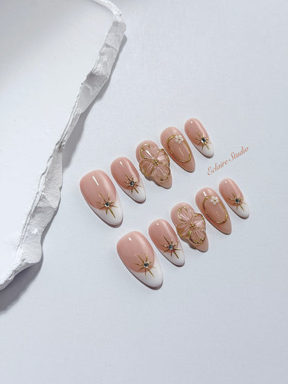 Golden Fleur white French tip press-on nails with 3D cherry blossom florals and gold starbursts – Éclaire Studio