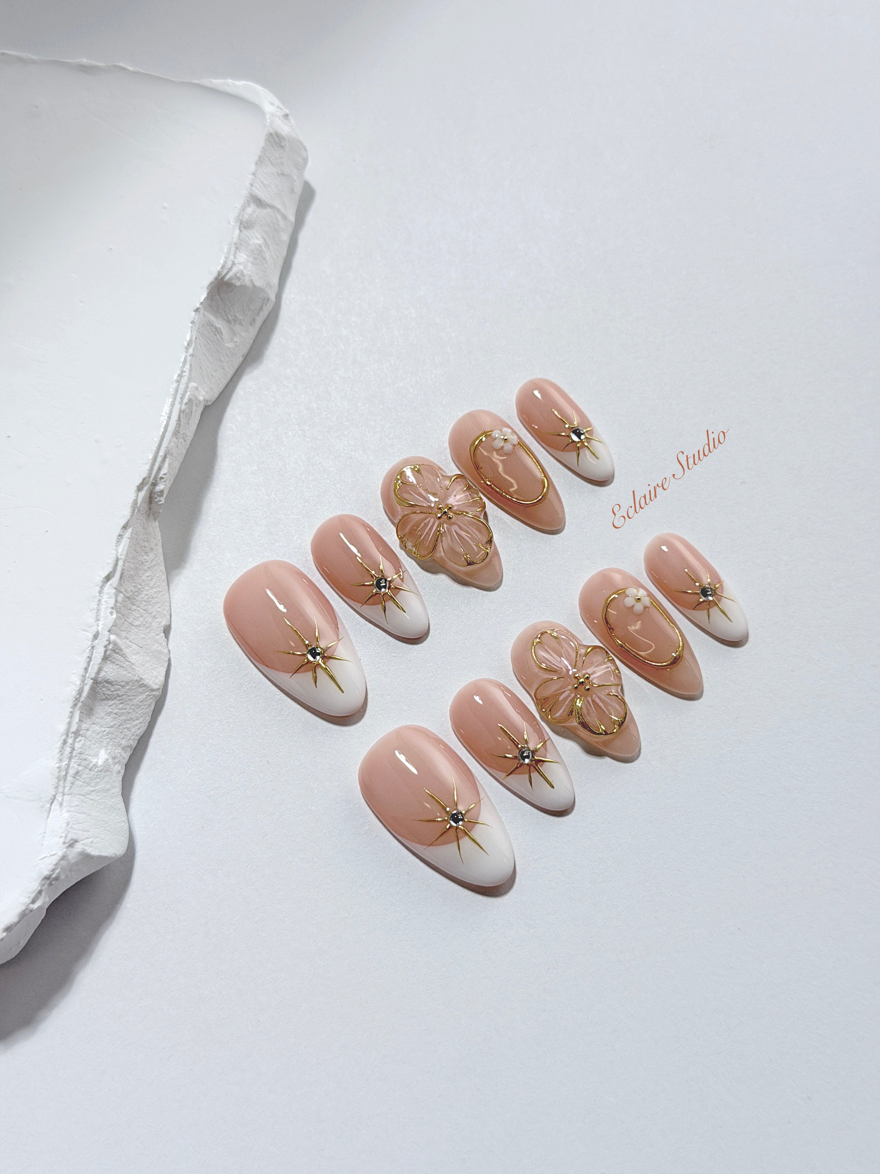 Golden Fleur white French tip press-on nails with 3D cherry blossom florals and gold starbursts – Éclaire Studio
