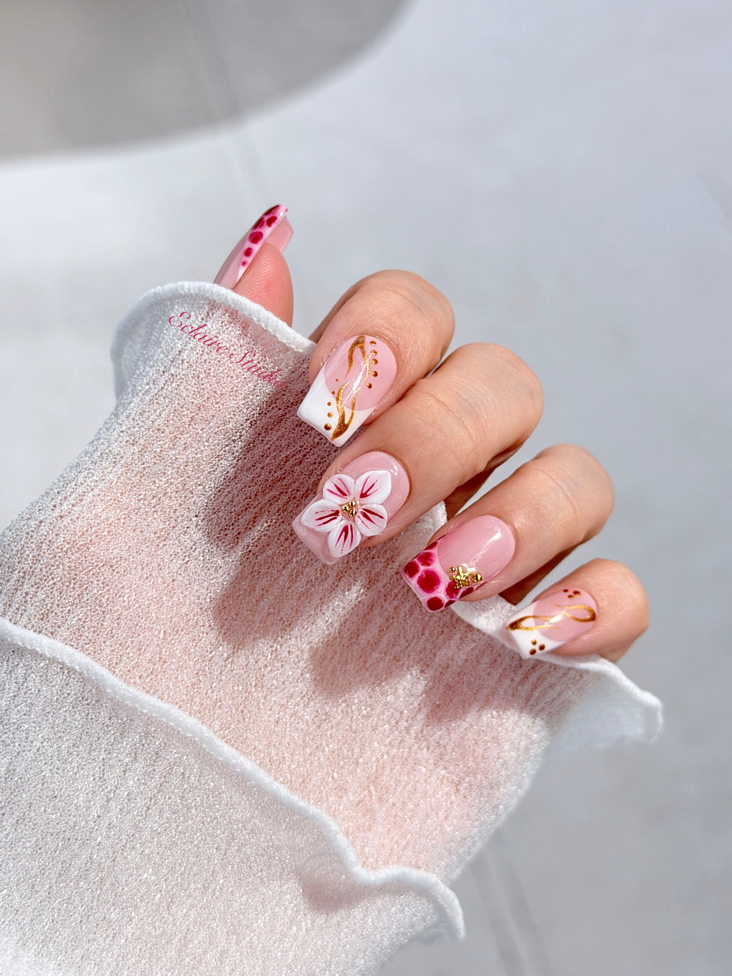 Marbella square press-on nails with wine watercolor French tips, gold swirls, starfish charms and 3D lily – Éclaire Studio