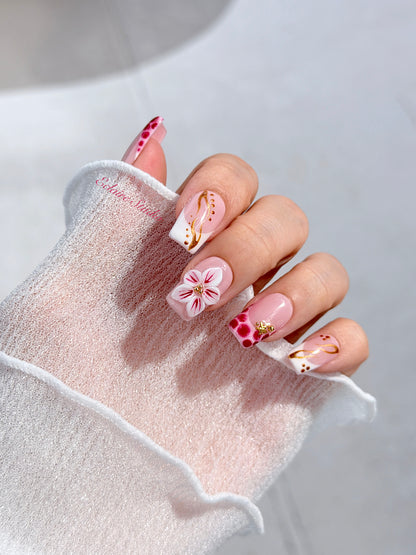 Marbella square press-on nails with wine watercolor French tips, gold swirls, starfish charms and 3D lily – Éclaire Studio