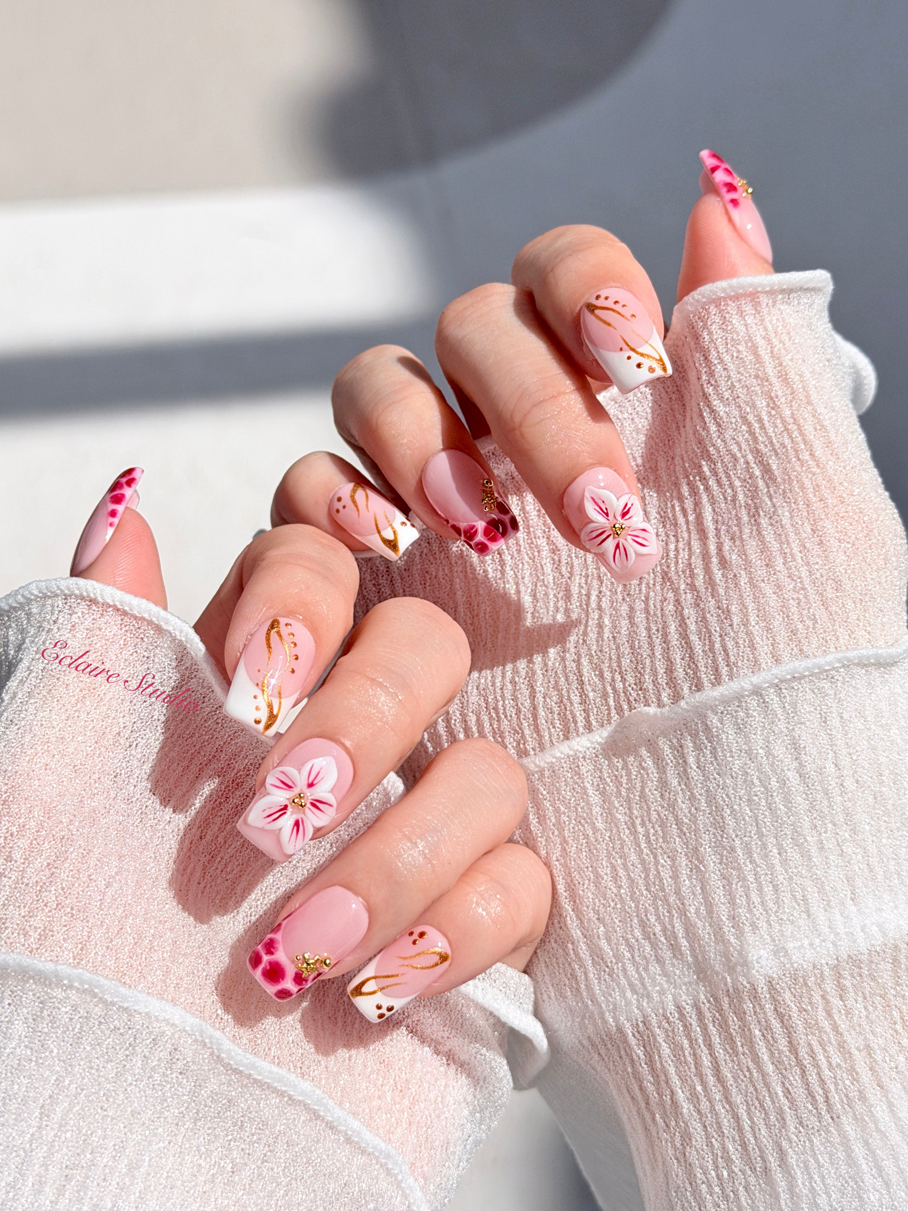 Marbella square press-on nails with wine watercolor French tips, gold swirls, starfish charms and 3D lily – Éclaire Studio