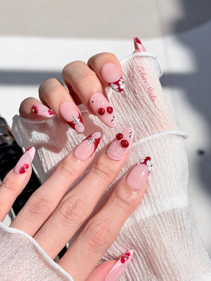 Cherry Kiss pink French press-on nails with wine florals, glossy 3D cherries and silver charms – Éclaire Studio