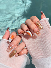 Dune caramel and espresso press-on nails with gold chrome wave, starbursts and opal gem – Éclaire Studio