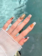 Dune caramel and espresso press-on nails with gold chrome wave, starbursts and opal gem – Éclaire Studio