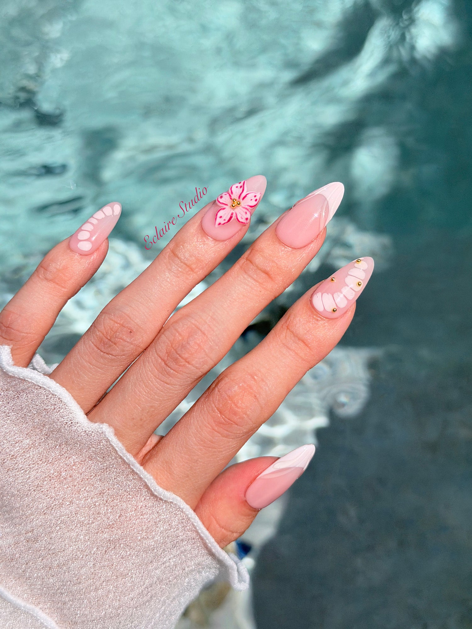 Belle Rose almond press-on nails with milky pink French tips, hand-painted petals and 3D floral accent – Éclaire Studio