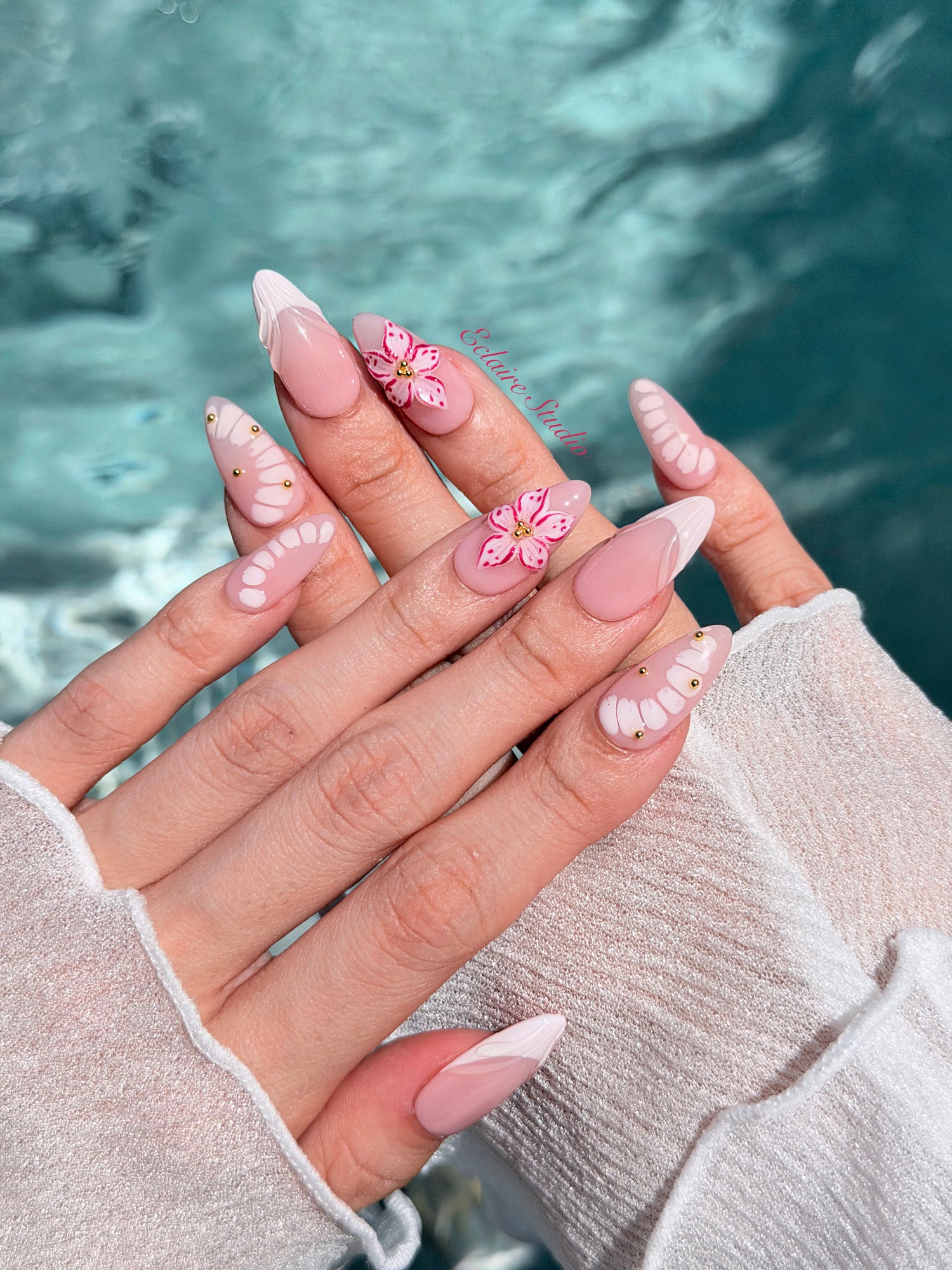 Belle Rose almond press-on nails with milky pink French tips, hand-painted petals and 3D floral accent – Éclaire Studio