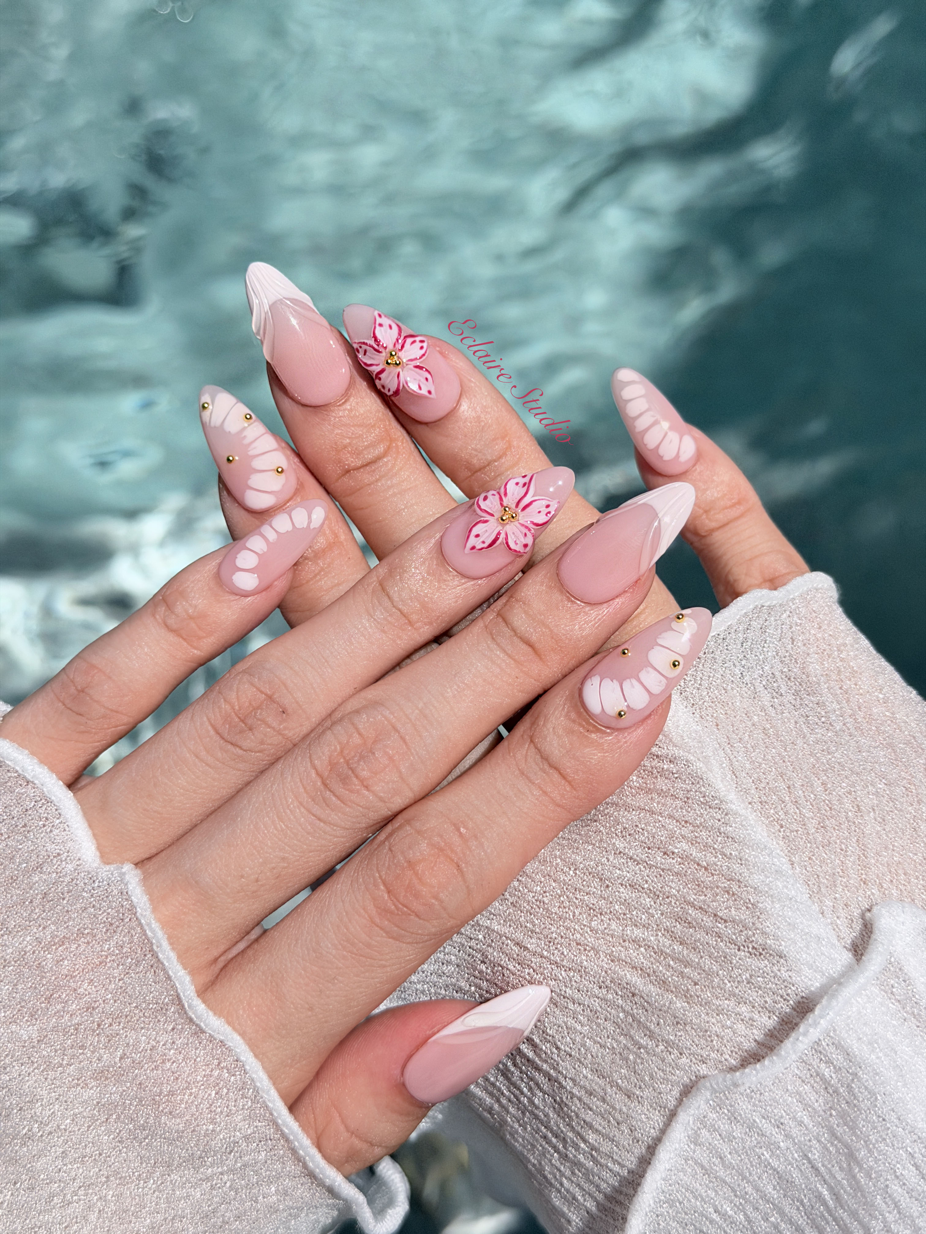 Belle Rose almond press-on nails with milky pink French tips, hand-painted petals and 3D floral accent – Éclaire Studio