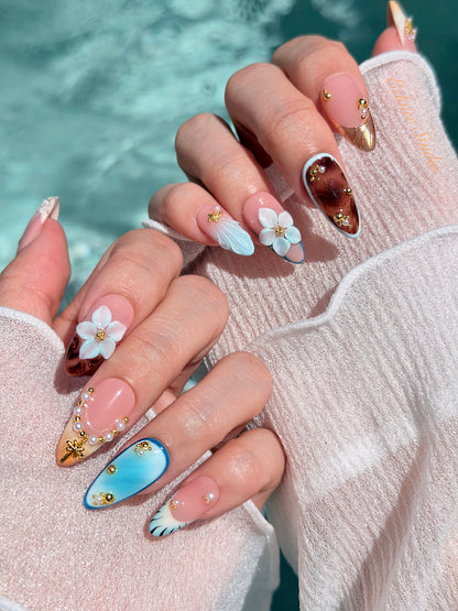 Seabreeze blue-to-amber ombré press-on nails with 3D flowers, pearls and shell French tips – Éclaire Studio