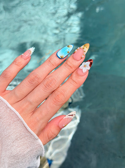 Seabreeze blue-to-amber ombré press-on nails with 3D flowers, pearls and shell French tips – Éclaire Studio