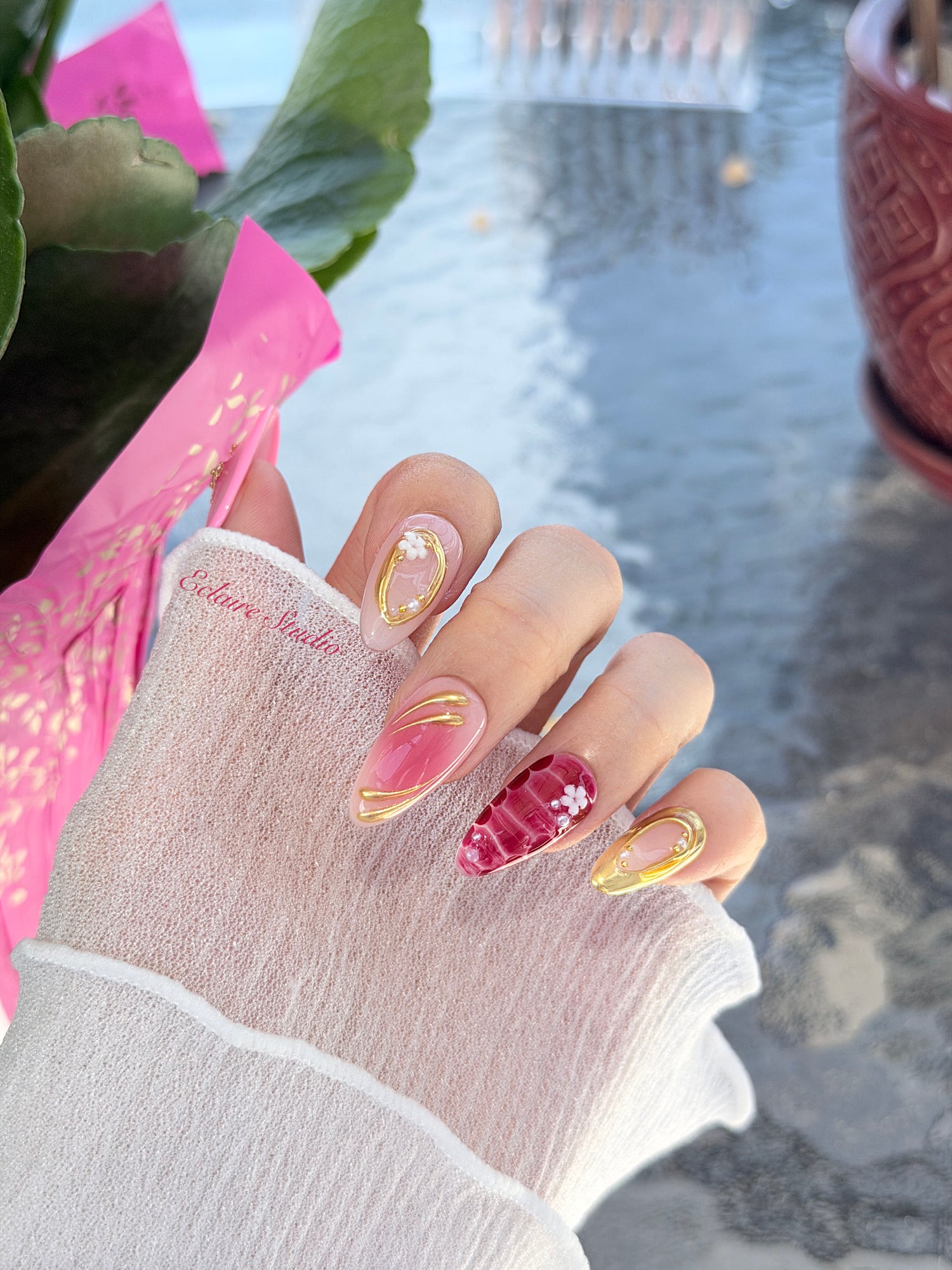 Strawberry Latte red ombré press-on nails with molten gold frames and floral accents – Éclaire Studio
