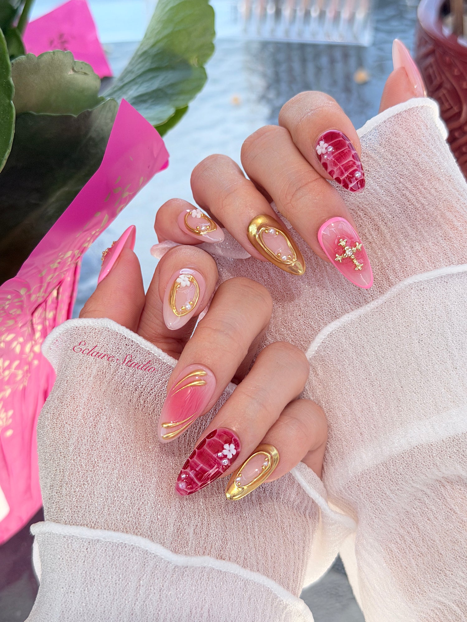 Strawberry Latte red ombré press-on nails with molten gold frames and floral accents – Éclaire Studio