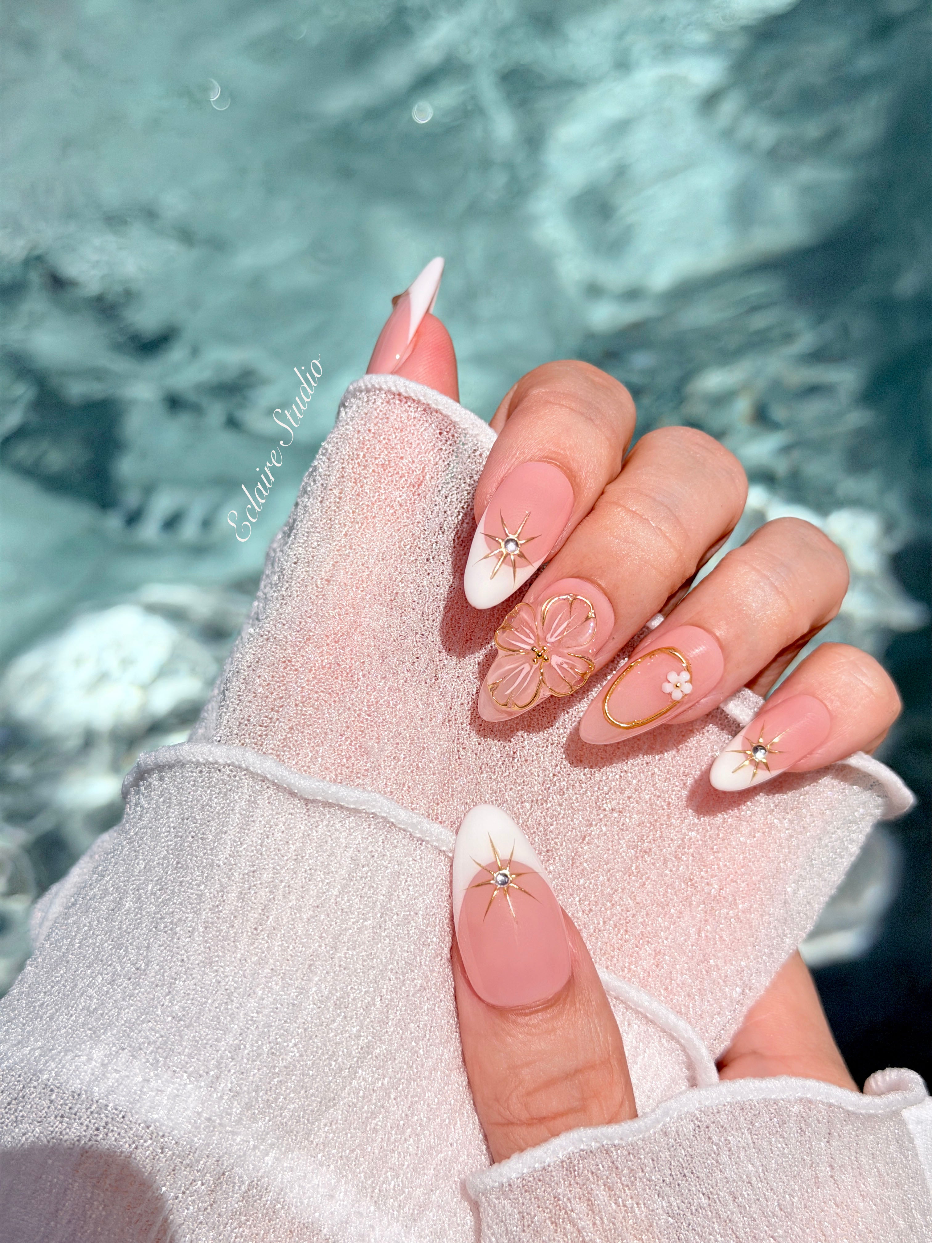 Golden Fleur white French tip press-on nails with 3D cherry blossom florals and gold starbursts – Éclaire Studio